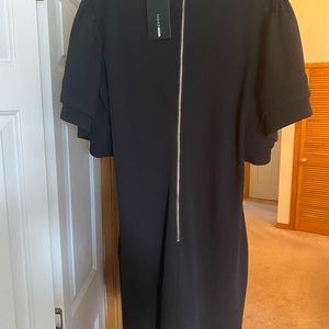 Cocktail dress with ruffle sleeves. Zips in the back. Form fitting and true to s